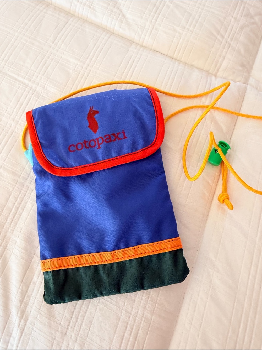 cotopaxi Royal Blue Crossbody Pouch with Orange Trim and Yellow Cord